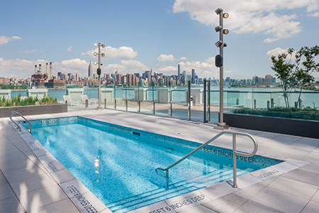 Outside pool with skyline view - 1N4 Williamsburg New York